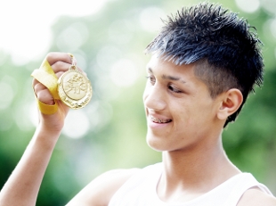 PLEASED AS PUNCH: <b>Ibby Shah</b> shows of his Three Nations gold medal - 1347886